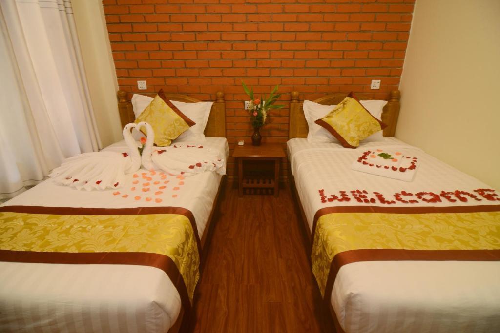 Twin room with two single beds at A Little Bit of Bagan Hotel